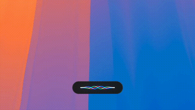 Archon's input bar, a small dark pill at the bottom of a colorful desktop, waiting for an instruction.
